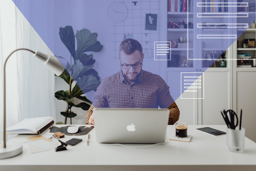 man sitting in front of open laptop