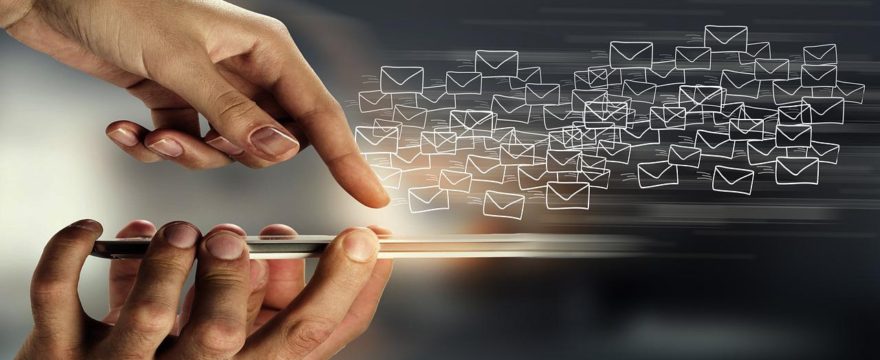 image of finger pointing to cell phone and mail icons